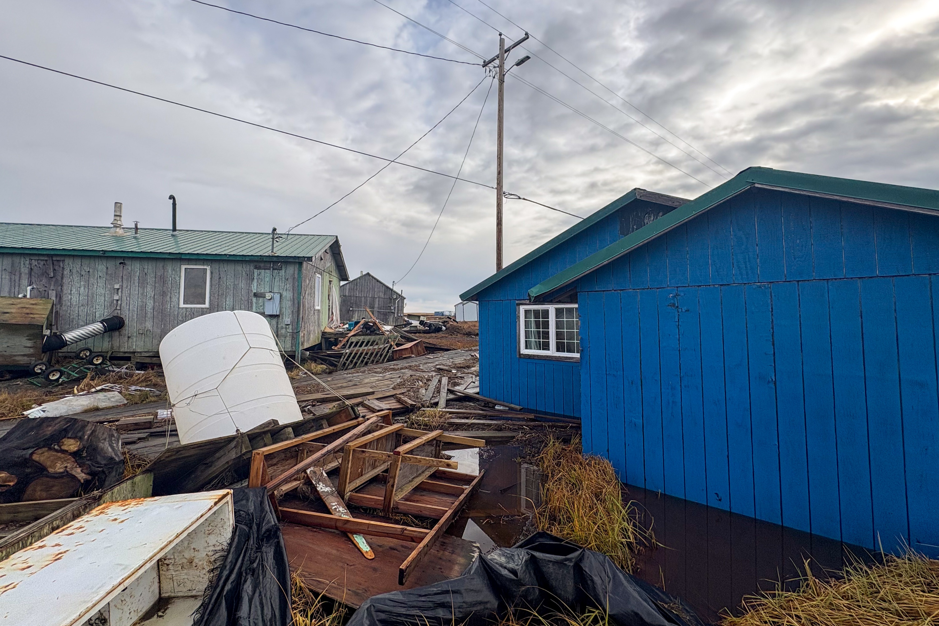 The remnants of typhoon Halong floated homes off their foundations and washed debris across the Western Alaska village of Kwigillingok on Thursday, Oct. 16, 2025. Residents lost boats, four-wheelers and snowmobiles/snowmachines — some of which scattered miles away from the community.